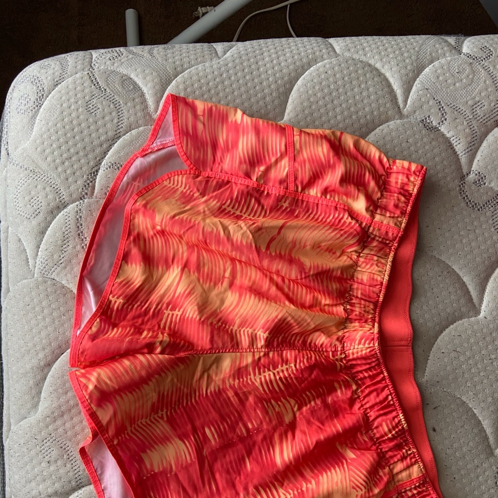 Orange athletic shorts with liner